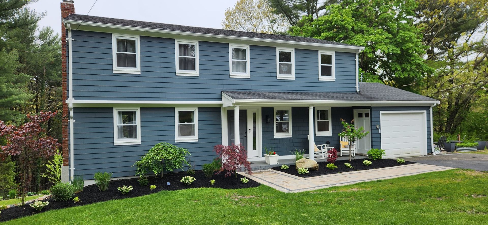 Premium coastal Massachusetts colonial home with cedar shingle siding, painted by Berchtold & Sons on the South Shore